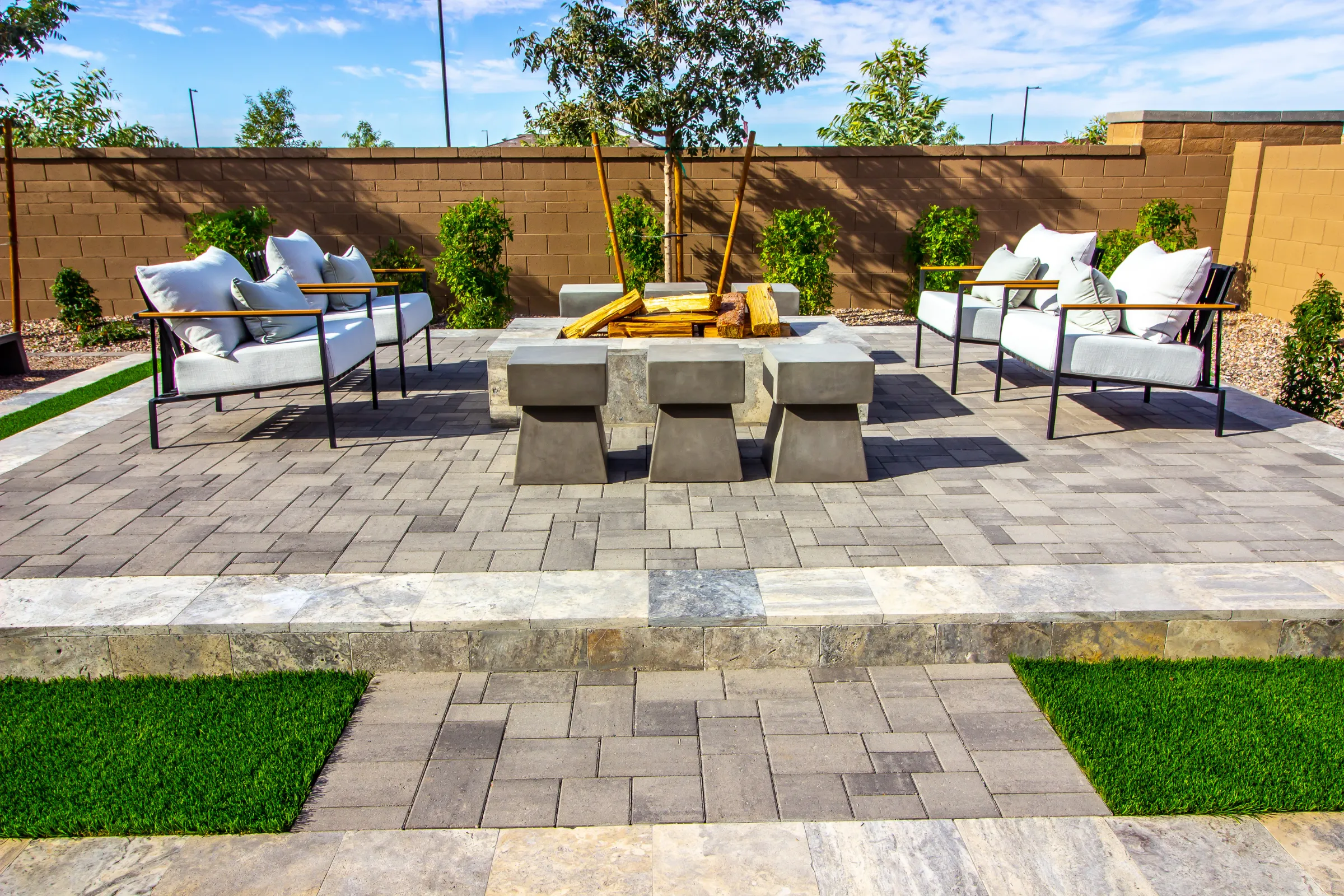 Paver patio hardscape in Los Angeles with fire pit, outdoor kitchen, and landscaped backyard design